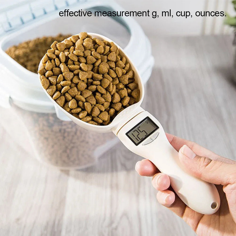 Digital pet food measuring scoop filled with kibble, showing measurement details.